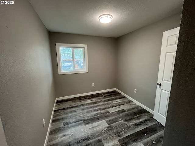 441 NE Johnson St, Myrtle Creek, OR 97457 - unfurnished room featuring dark wood-type flooring and baseboards
