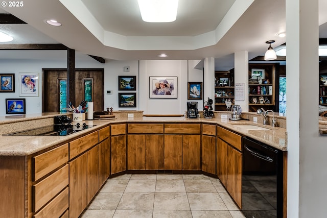 36910 Edgehill Rd, Springfield, OR 97478 - kitchen featuring black appliances, brown cabinetry, light stone counters, a raised ceiling, and light tile patterned floors