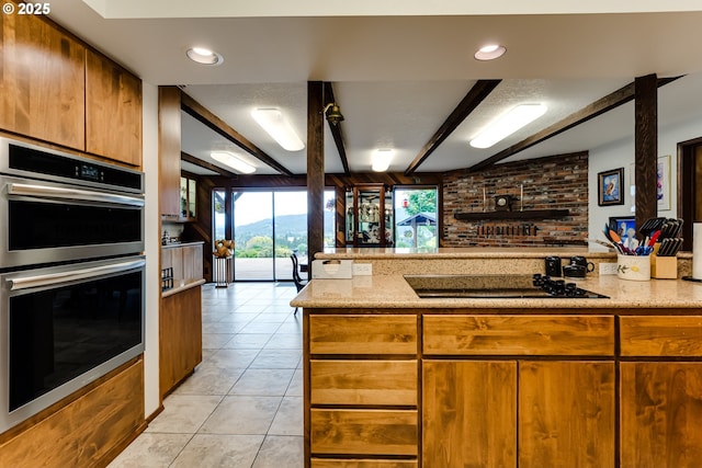 36910 Edgehill Rd, Springfield, OR 97478 - kitchen with double oven, black electric stovetop, light tile patterned floors, open floor plan, and beam ceiling