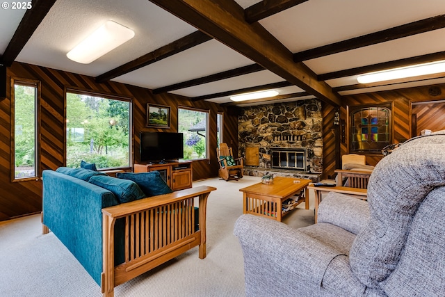 36910 Edgehill Rd, Springfield, OR 97478 - carpeted living area featuring wooden walls, beam ceiling, and a fireplace
