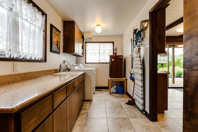 36910 Edgehill Rd, Springfield, OR 97478 - laundry room featuring cabinet space, independent washer and dryer, healthy amount of natural light, and light tile patterned floors