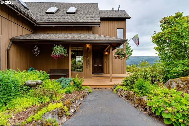36910 Edgehill Rd, Springfield, OR 97478 - doorway to property with a shingled roof and covered porch