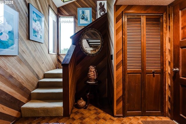 36910 Edgehill Rd, Springfield, OR 97478 - staircase featuring wood walls and brick patterned flooring