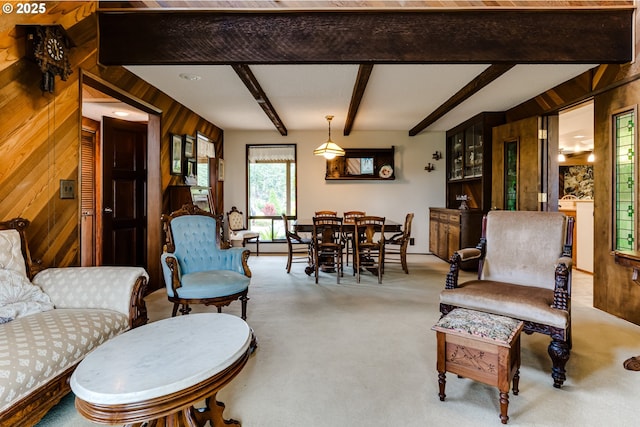36910 Edgehill Rd, Springfield, OR 97478 - carpeted living room featuring wood walls, beamed ceiling, and a baseboard radiator
