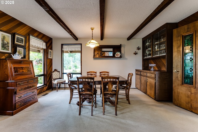 36910 Edgehill Rd, Springfield, OR 97478 - dining area featuring a textured ceiling, light colored carpet, and beam ceiling