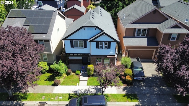 birds eye view of property with a residential view