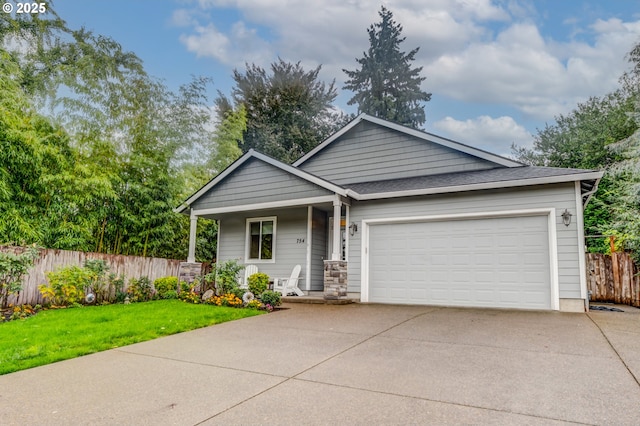 754 Manbrin Dr N, Keizer, OR 97303 - view of front of house featuring concrete driveway, an attached garage, and a porch