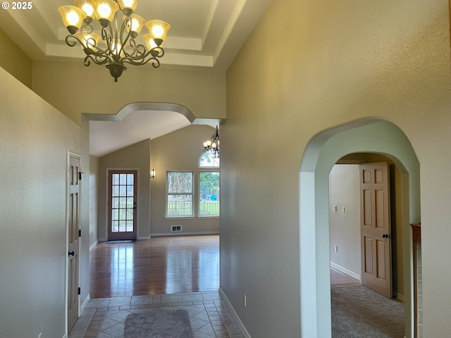 2180 Hayes St, North Bend, OR 97459 - hall with a chandelier, arched walkways, baseboards, and a high ceiling