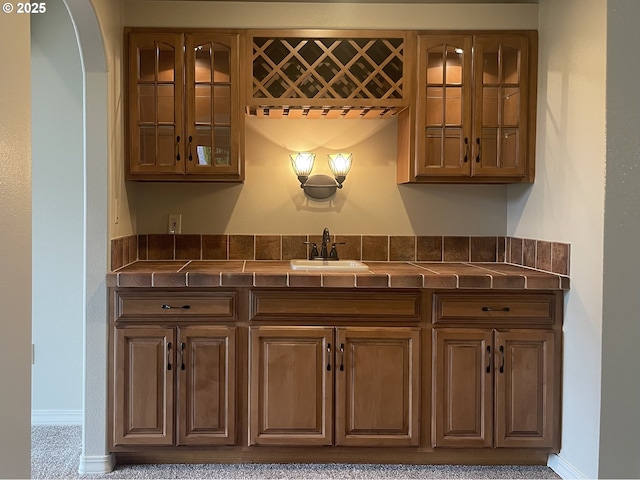 2180 Hayes St, North Bend, OR 97459 - bar area featuring a sink, baseboards, and arched walkways