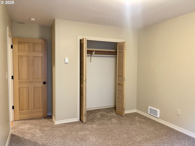 2180 Hayes St, North Bend, OR 97459 - unfurnished bedroom with carpet, a closet, and baseboards
