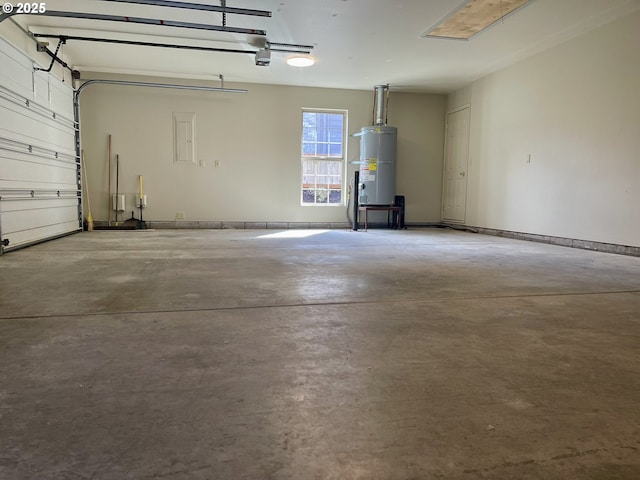2180 Hayes St, North Bend, OR 97459 - garage with strapped water heater and a garage door opener