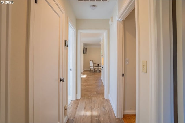 hallway featuring light hardwood / wood-style flooring