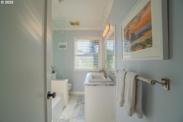 bathroom featuring vanity, crown molding, and toilet