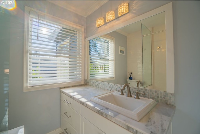 bathroom featuring vanity and ornamental molding