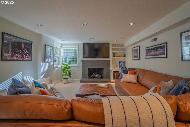 3190 SW Ridgewood Ave, Portland, OR 97225 - living area with carpet, a fireplace with raised hearth, baseboards, recessed lighting, and built in features