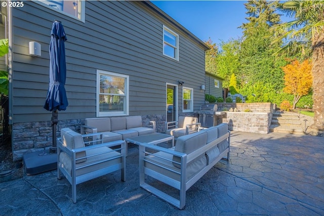 view of patio with a grill and an outdoor hangout area