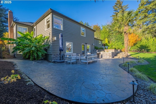 back of house featuring a patio