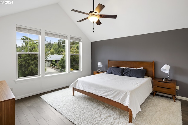 8235 SW 47th Ave, Portland, OR 97219 - bedroom featuring baseboards, wood finished floors, high vaulted ceiling, and ceiling fan