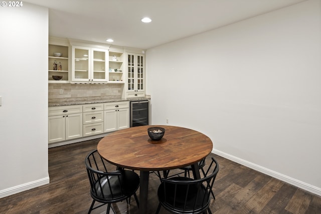 8235 SW 47th Ave, Portland, OR 97219 - dining space featuring beverage cooler, baseboards, a dry bar, dark wood finished floors, and recessed lighting