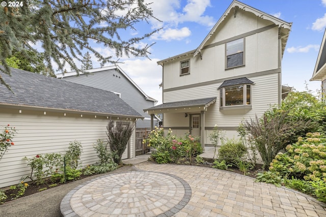 8235 SW 47th Ave, Portland, OR 97219 - rear view of property with a patio and roof with shingles