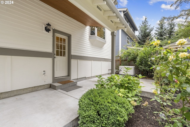 8235 SW 47th Ave, Portland, OR 97219 - entrance to property with board and batten siding and a patio