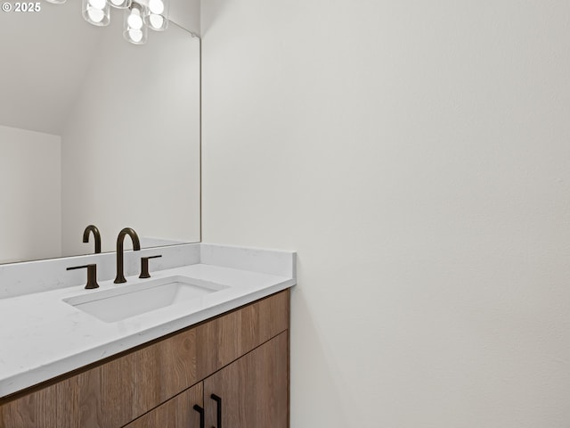 7582 N Alma Ave Unit 4, Portland, OR 97203 - bathroom featuring vanity and vaulted ceiling