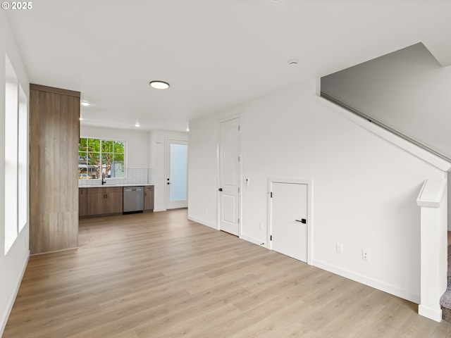 7582 N Alma Ave Unit 4, Portland, OR 97203 - unfurnished living room with light wood finished floors, recessed lighting, and baseboards