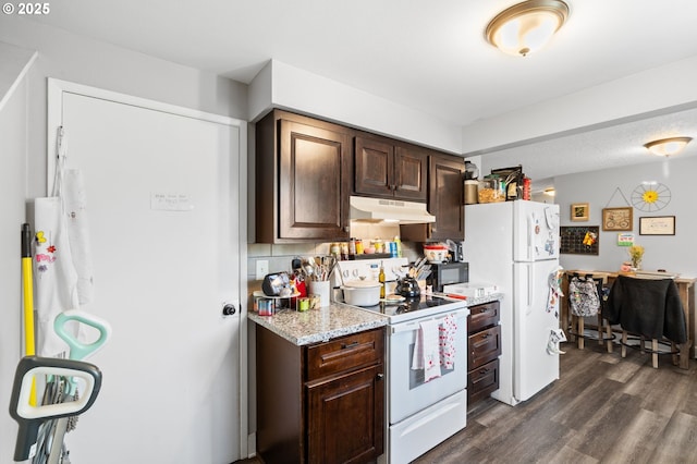 kitchen with dark brown cabinetry, dark hardwood / wood-style floors, white appliances, and decorative backsplash