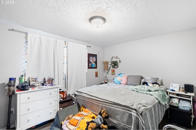 bedroom featuring a textured ceiling