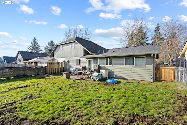 rear view of property with a patio area and a lawn