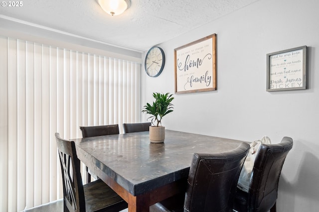 dining area with a textured ceiling