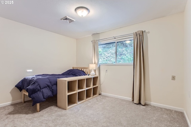 carpeted bedroom featuring baseboards