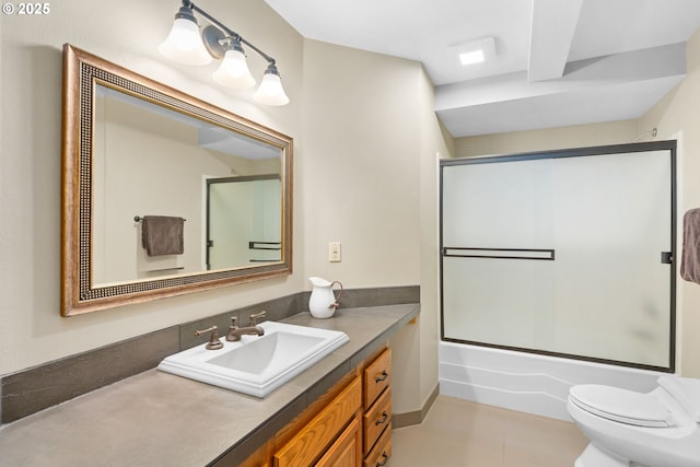 bathroom with toilet, vanity, shower / bath combination with glass door, and tile patterned flooring