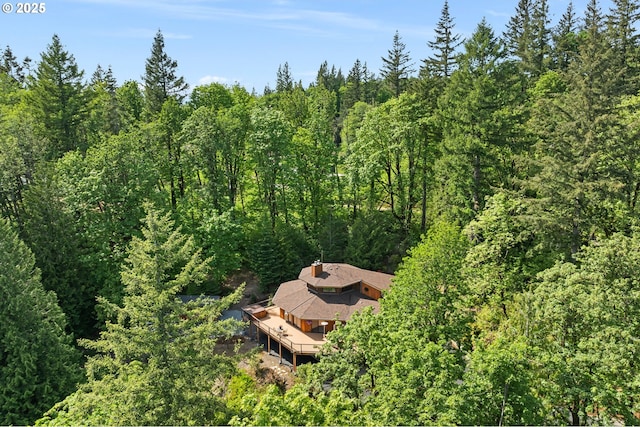 view of subject property featuring a forest