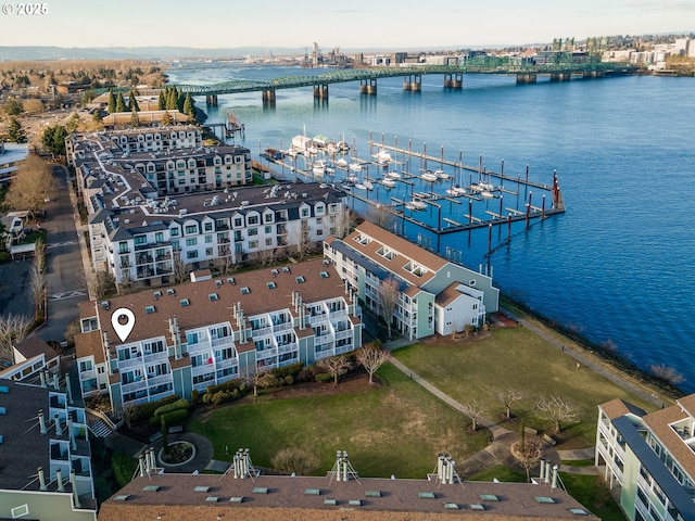 birds eye view of property with a water view