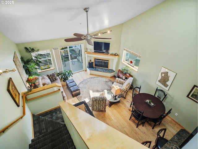 living room with hardwood / wood-style flooring and vaulted ceiling