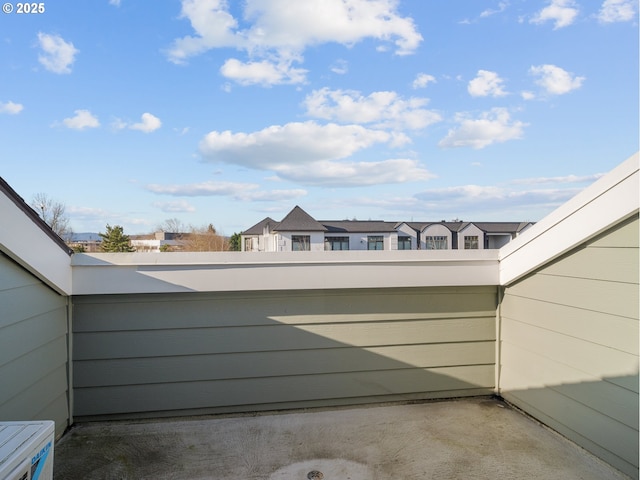 view of patio featuring a balcony