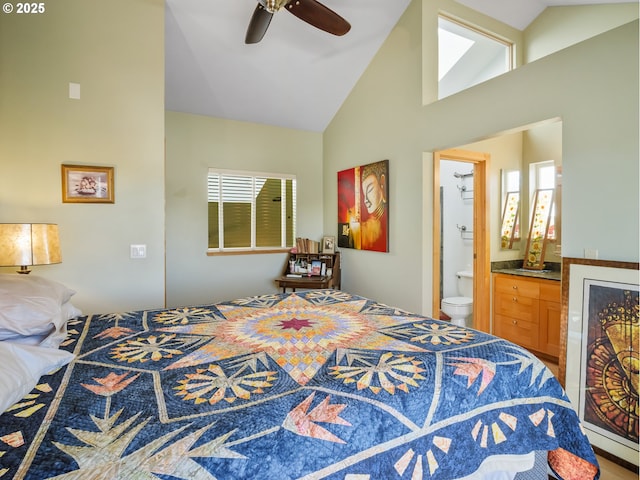 bedroom featuring ceiling fan, connected bathroom, and vaulted ceiling