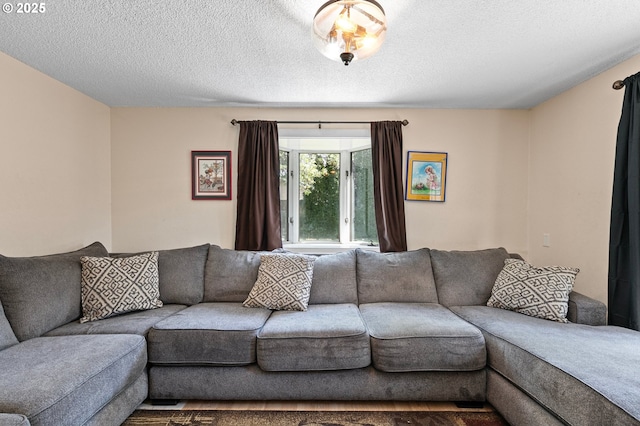 living area featuring a textured ceiling