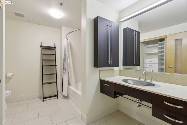 full bathroom with vanity, toilet, visible vents, and tile patterned flooring