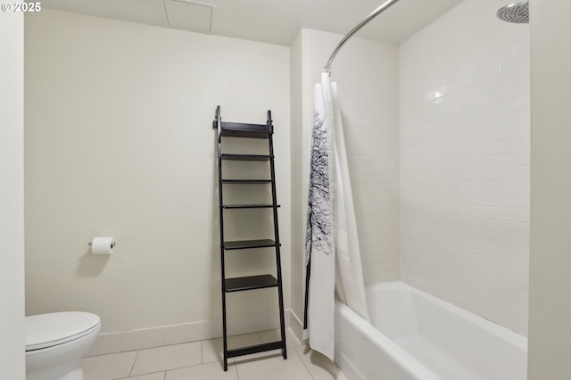 full bathroom with tile patterned floors, baseboards, toilet, and shower / tub combo