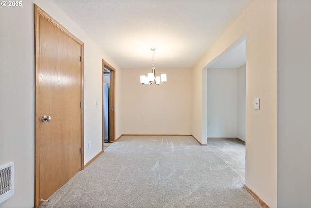 251 NE Village Squire Ave Unit 15, Gresham, OR 97030 - hallway with a chandelier, light colored carpet, heating unit, and baseboards