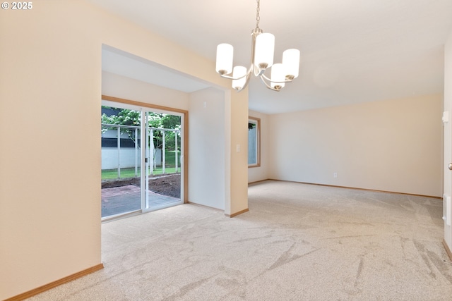 251 NE Village Squire Ave Unit 15, Gresham, OR 97030 - carpeted spare room with a chandelier and baseboards