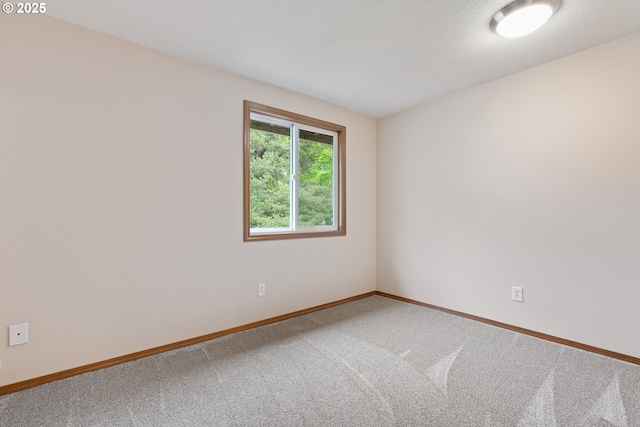 251 NE Village Squire Ave Unit 15, Gresham, OR 97030 - carpeted spare room featuring baseboards