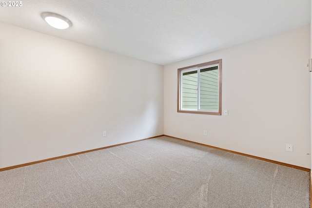 251 NE Village Squire Ave Unit 15, Gresham, OR 97030 - unfurnished room featuring light carpet and baseboards