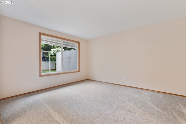 251 NE Village Squire Ave Unit 15, Gresham, OR 97030 - carpeted spare room with baseboards