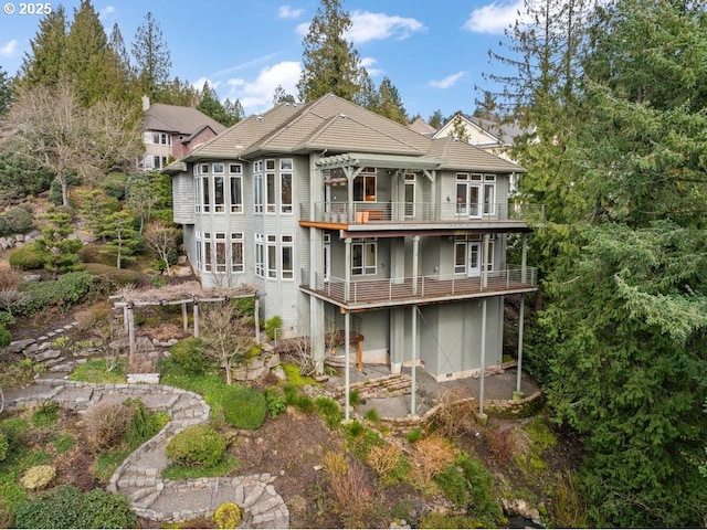 back of house with a balcony