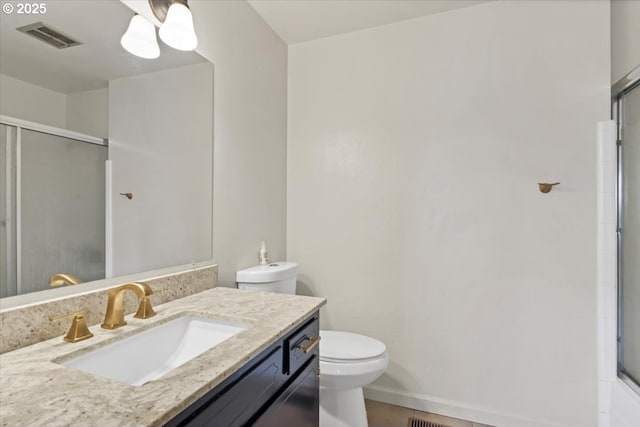 bathroom with an enclosed shower, toilet, visible vents, baseboards, and vanity