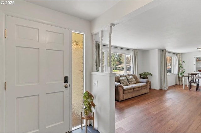 foyer featuring wood finished floors