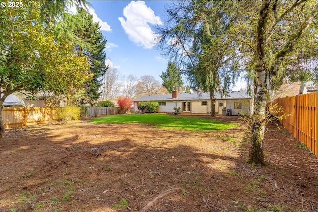 view of yard featuring a fenced backyard